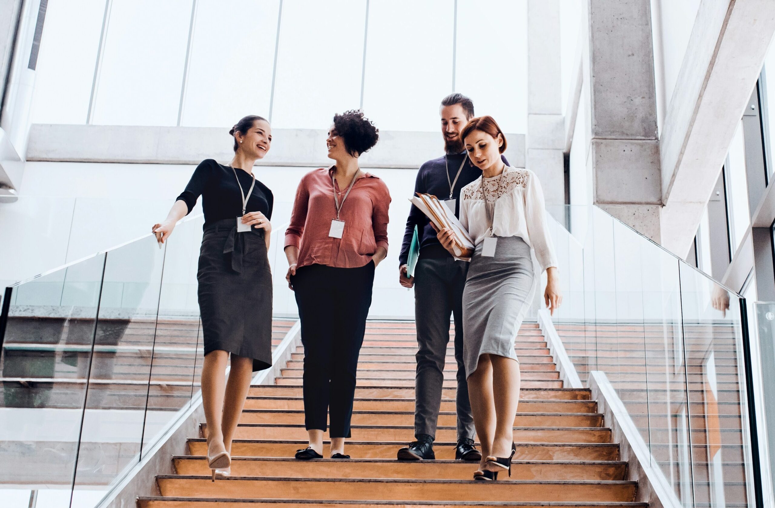 Corporate legal team walking together in a modern office building