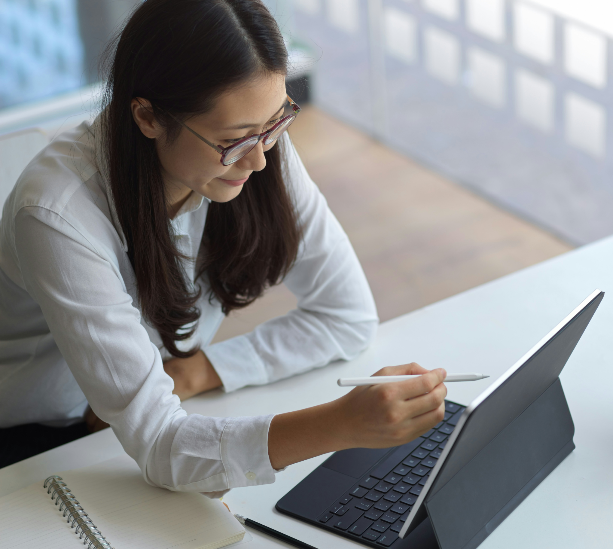 Professional working on a laptop at a desk