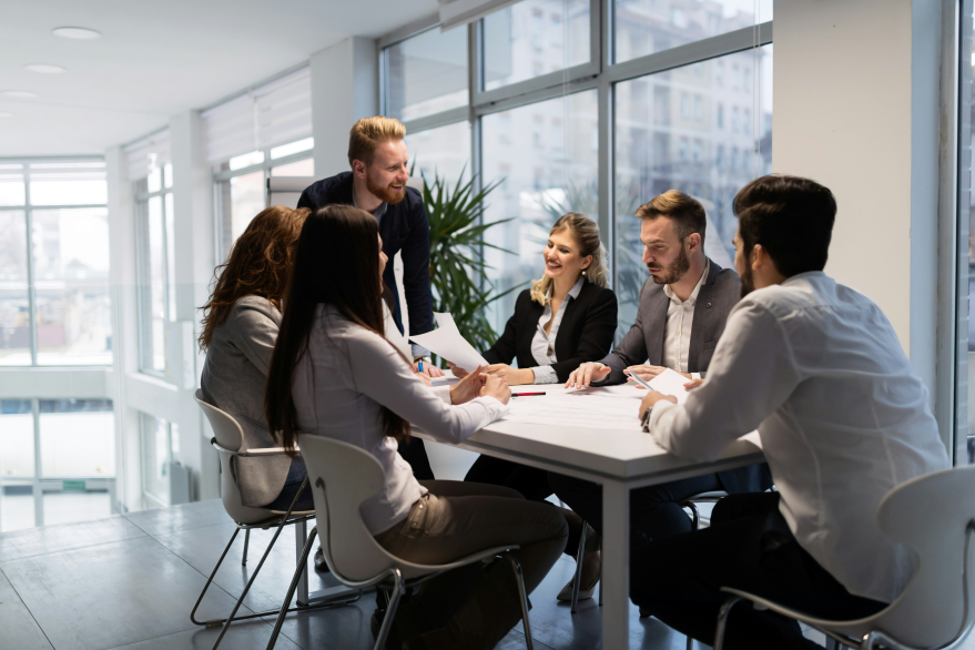 Legal professionals collaborating during a document review meeting